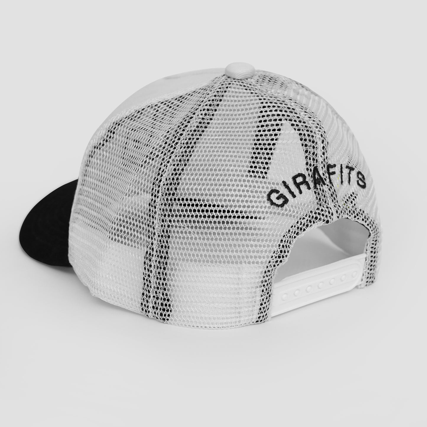 White and black cap with 'GIRAFITS' branding on a light gray background