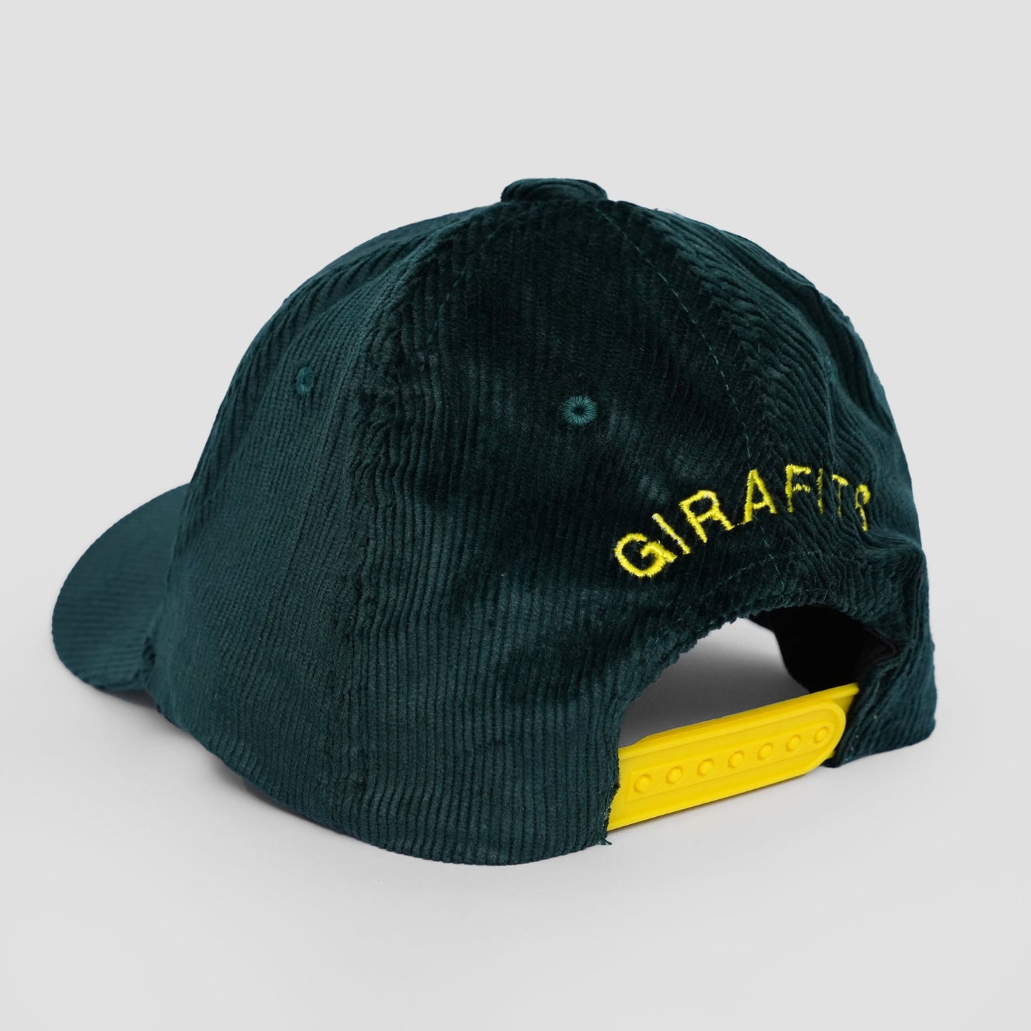 Green cap with 'GIRAFIT' branding on a gray background