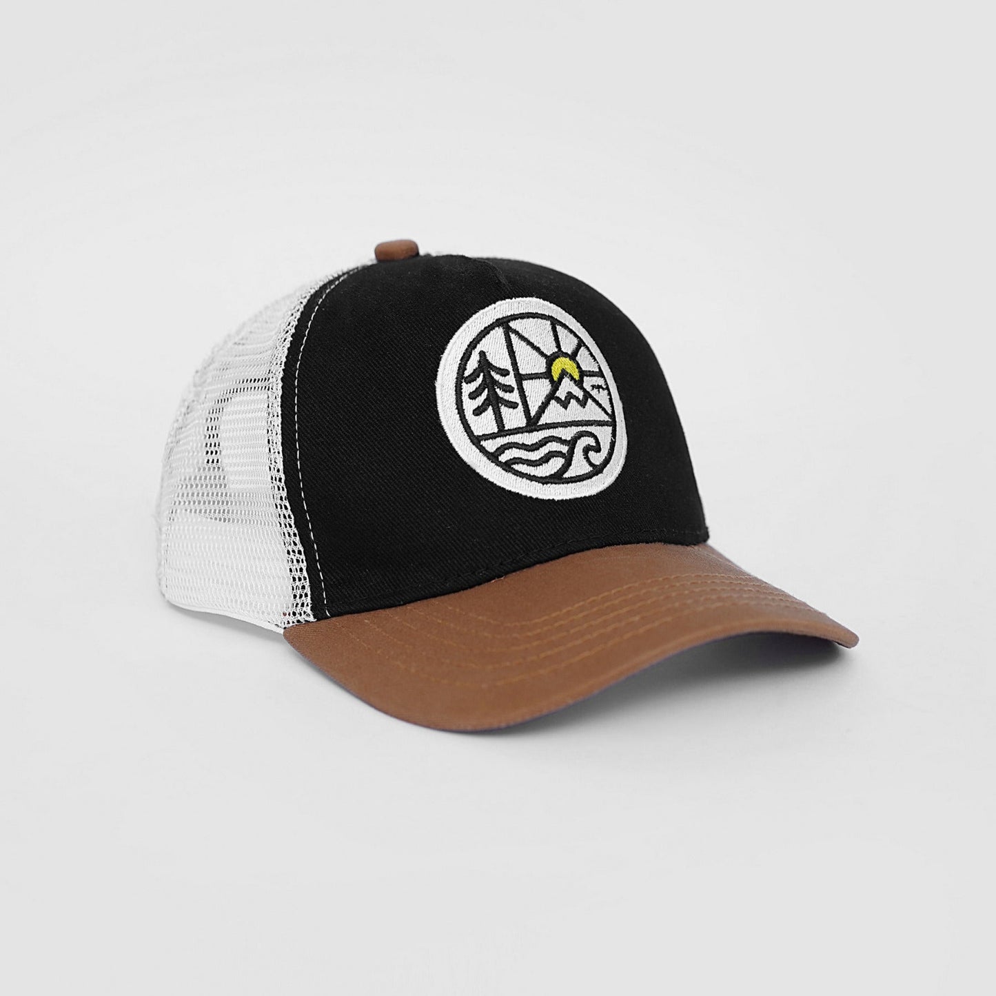 Black, white, and brown cap with a logo on a light gray background