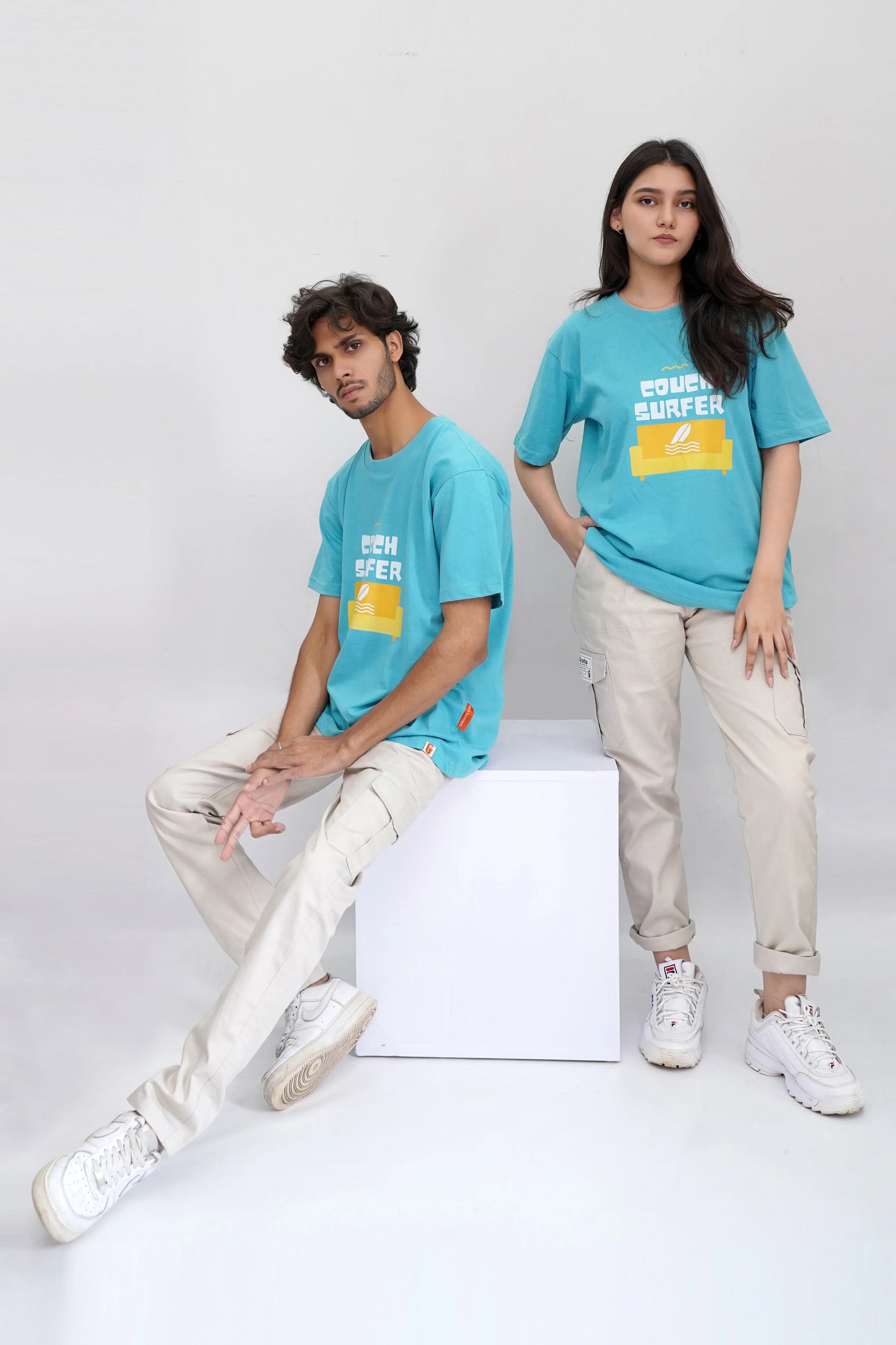 Blue oversized tee with "Couch Surfer" print, soft cotton fabric
