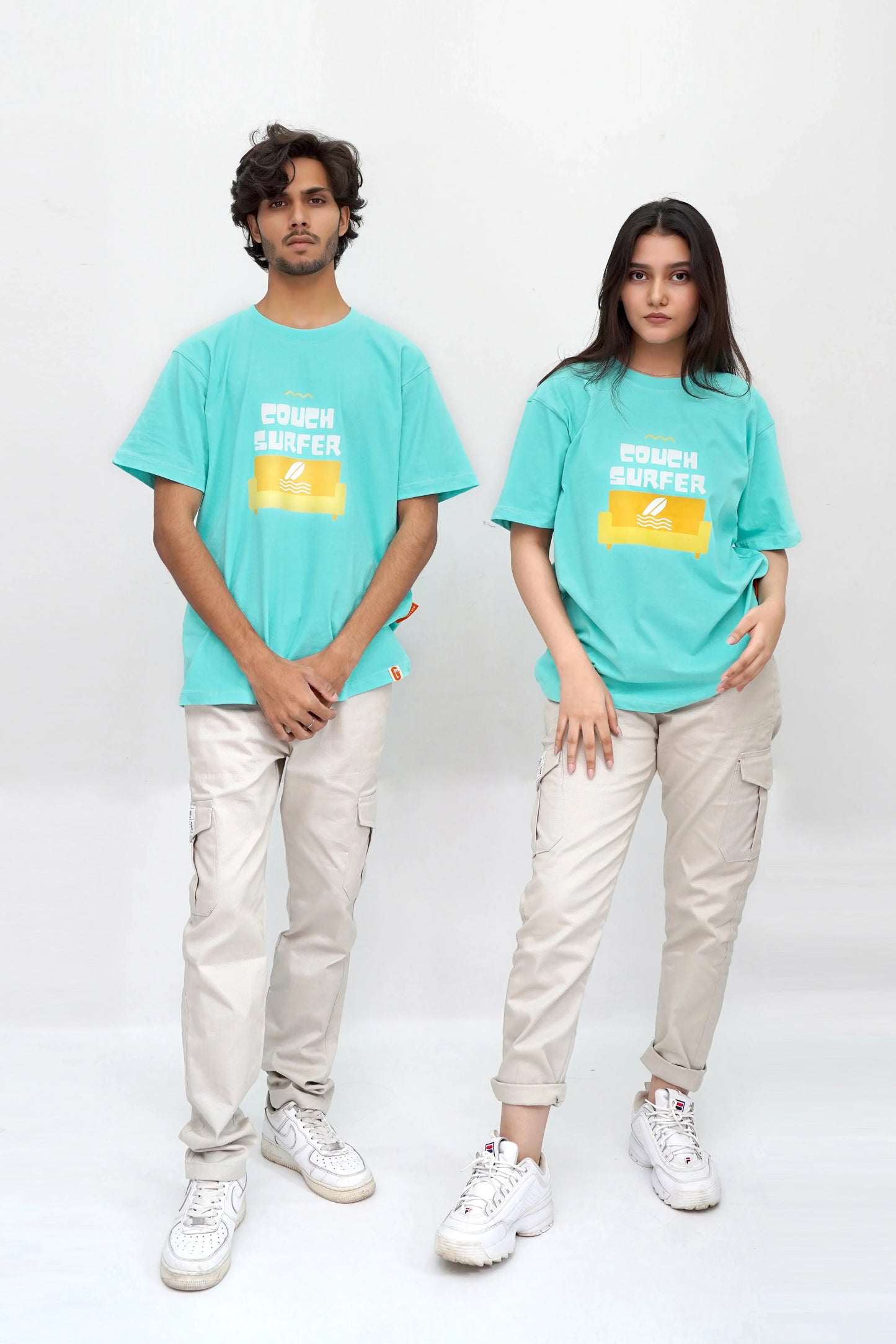 Teal oversized tee with "Couch Surfer" print, soft and breathable cotton