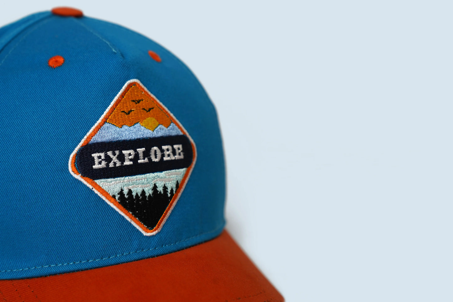 Premium dark blue and orange Explorer cap with embroidered patch