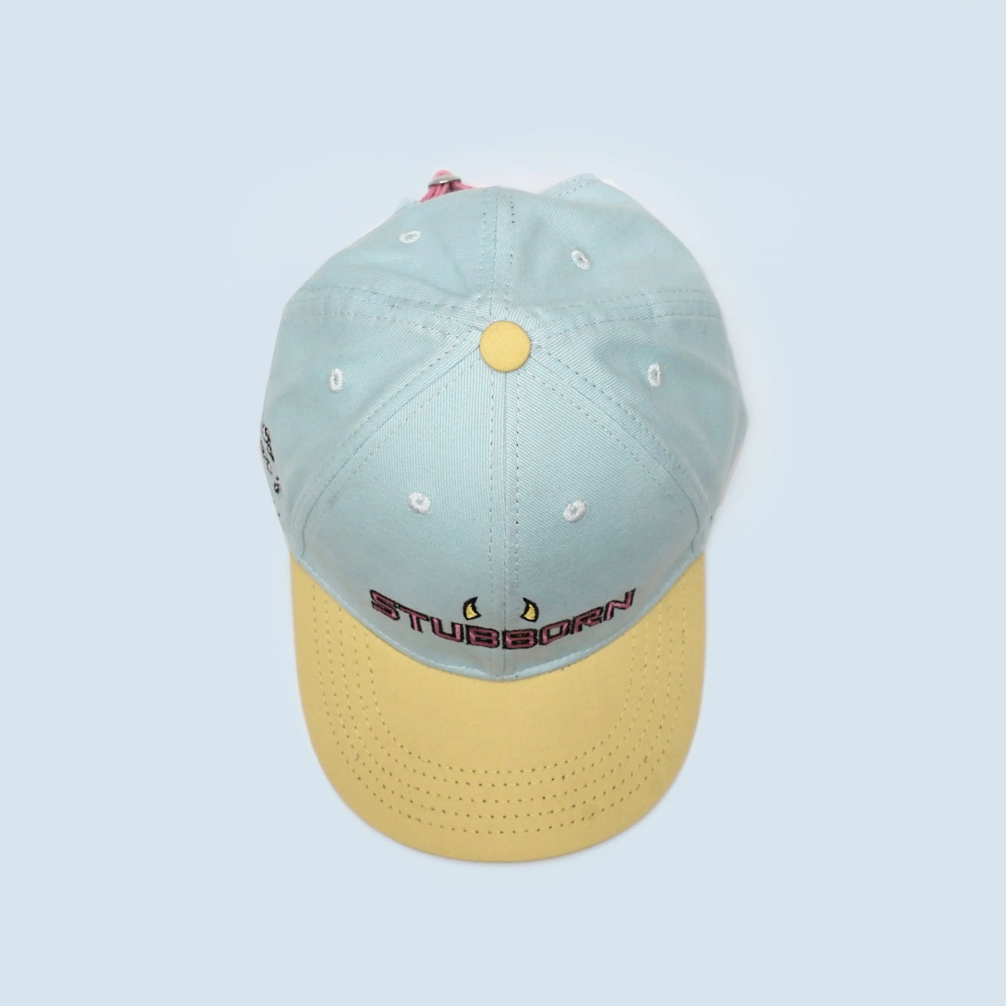 Premium sky blue and light yellow baseball cap with "Stubborn" 3D embroidery