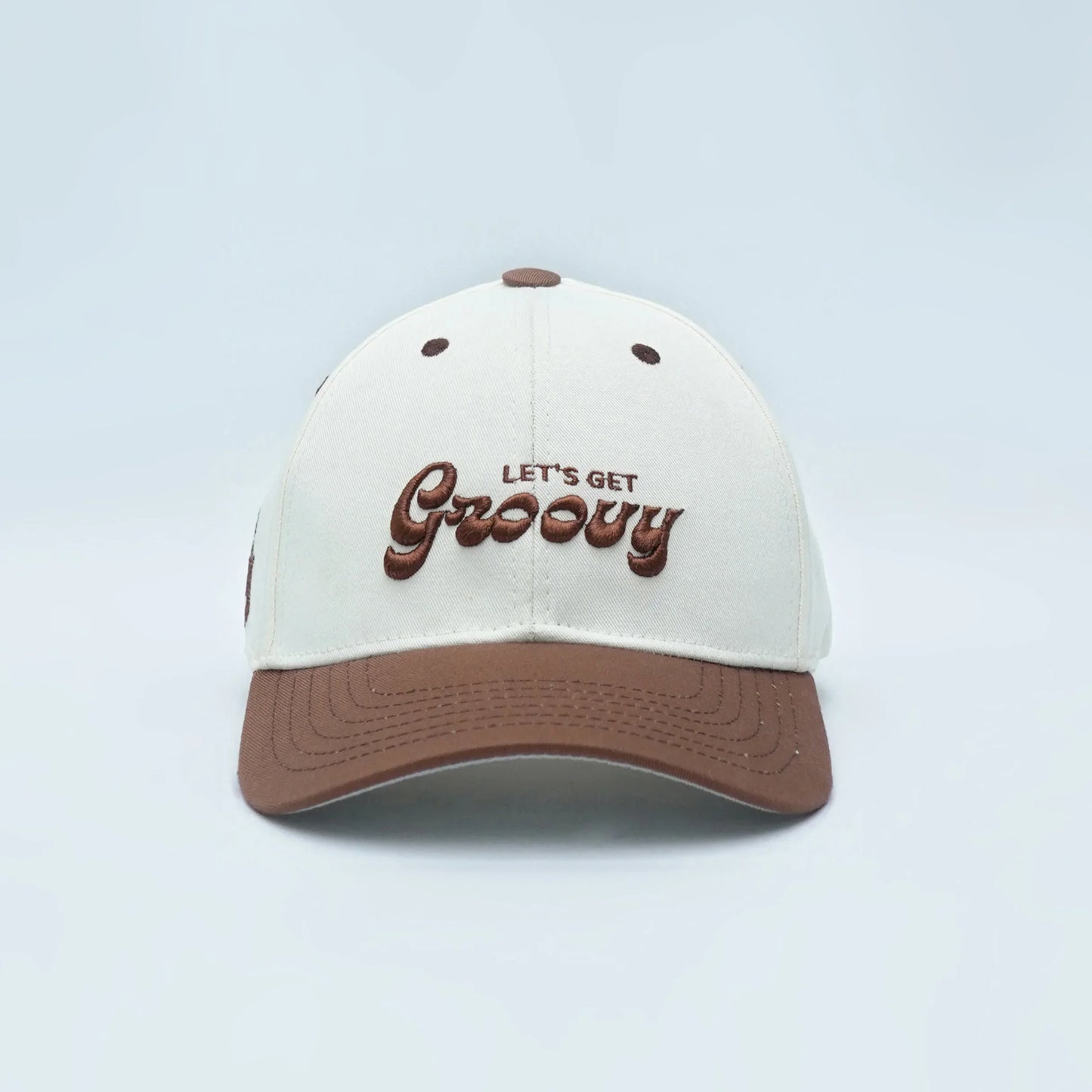 Premium baseball cap with 3D "Let's Get Groovy" text, cream and brown design