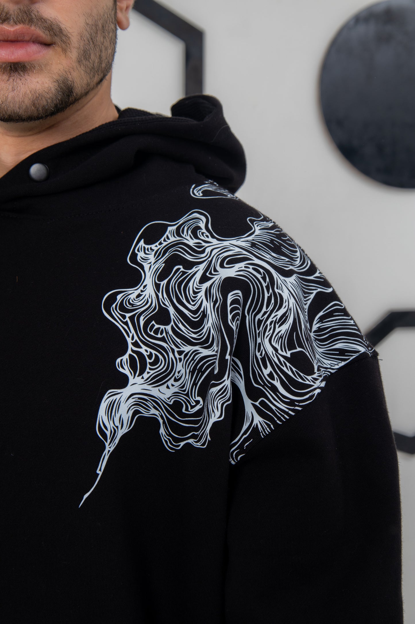 Unisex black hoodie with smoky print, super soft and comfortable