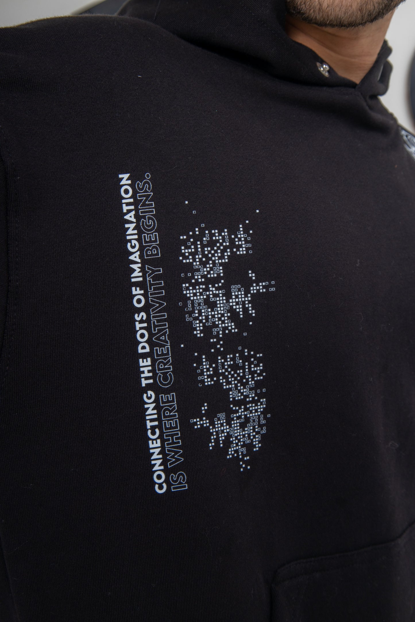 Black hoodie with smoky line design, soft cotton fleece, unisex fit