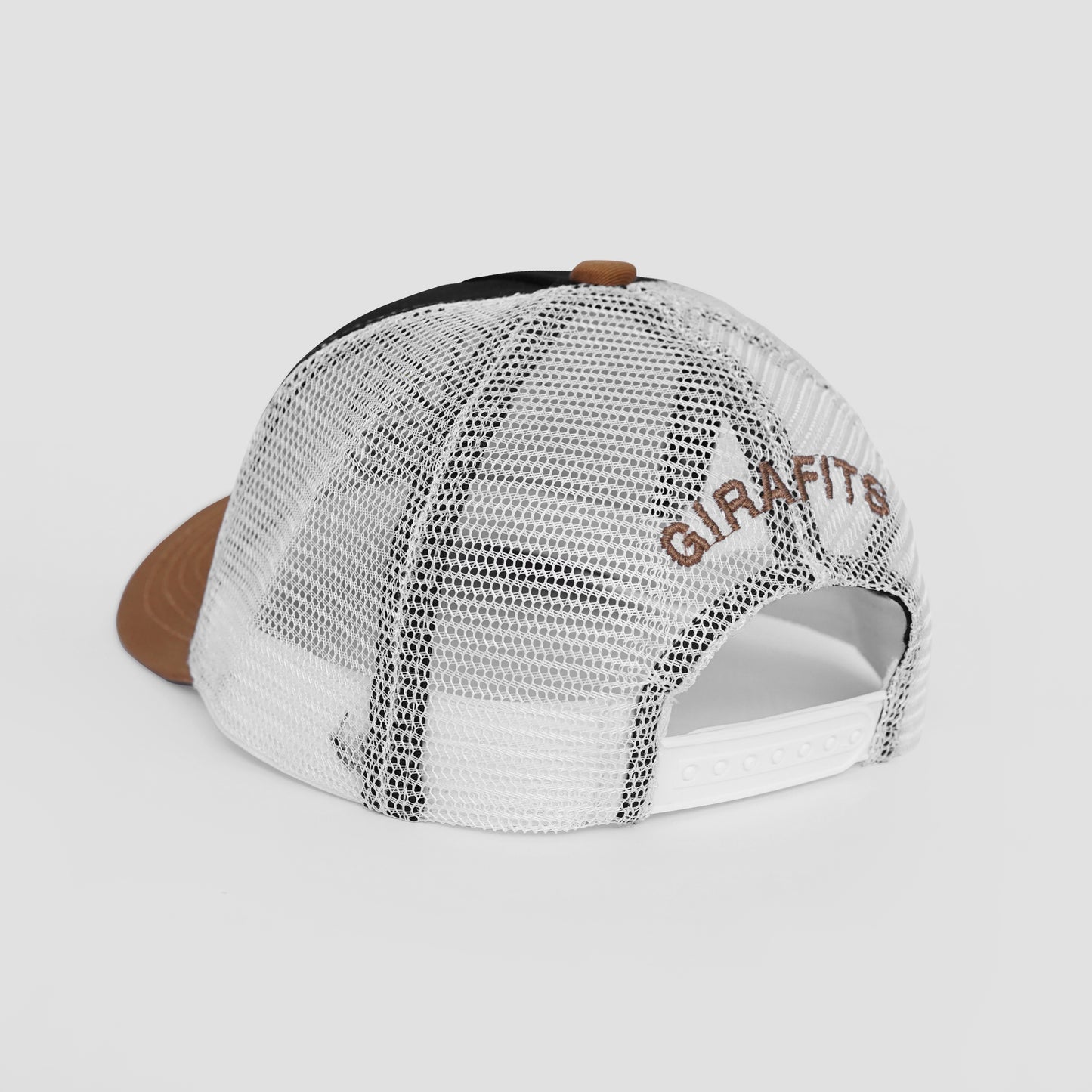 Trucker hat with mesh back and brown brim on a light gray background
