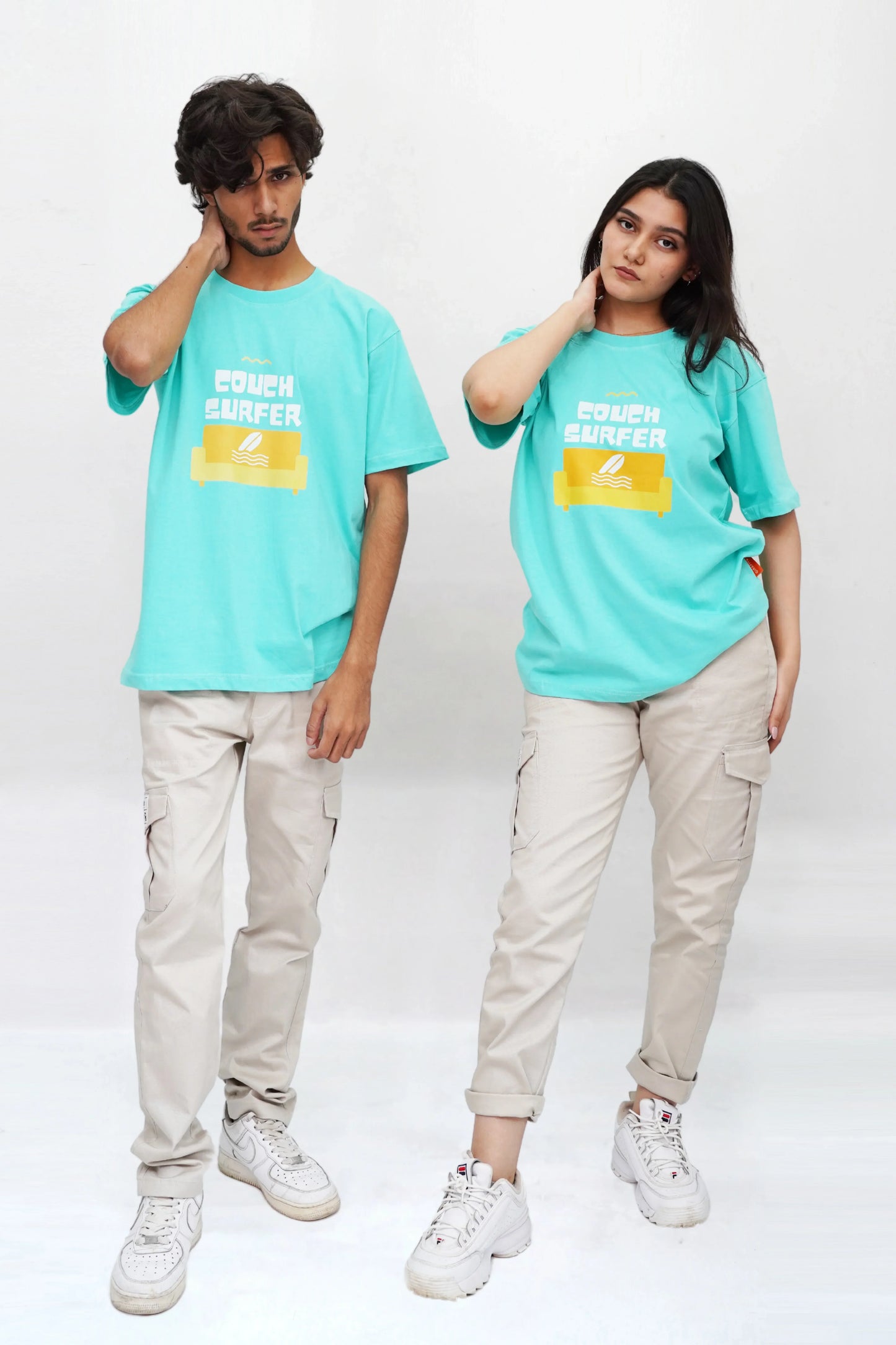 Streetwear-style teal t-shirt, "Couch Surfer" front print, oversized fit