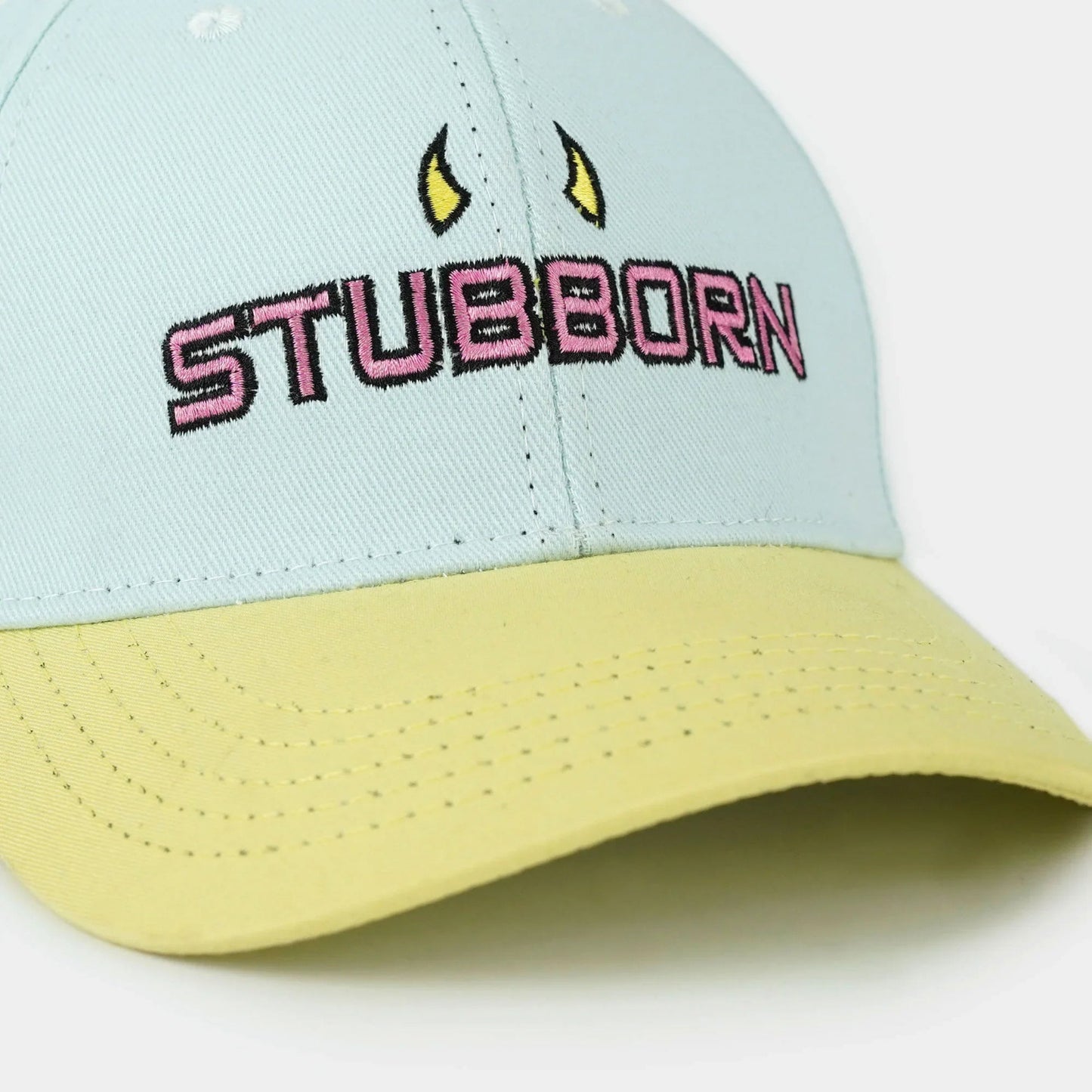 Premium sky blue and light yellow baseball cap with "Stubborn" 3D embroidery