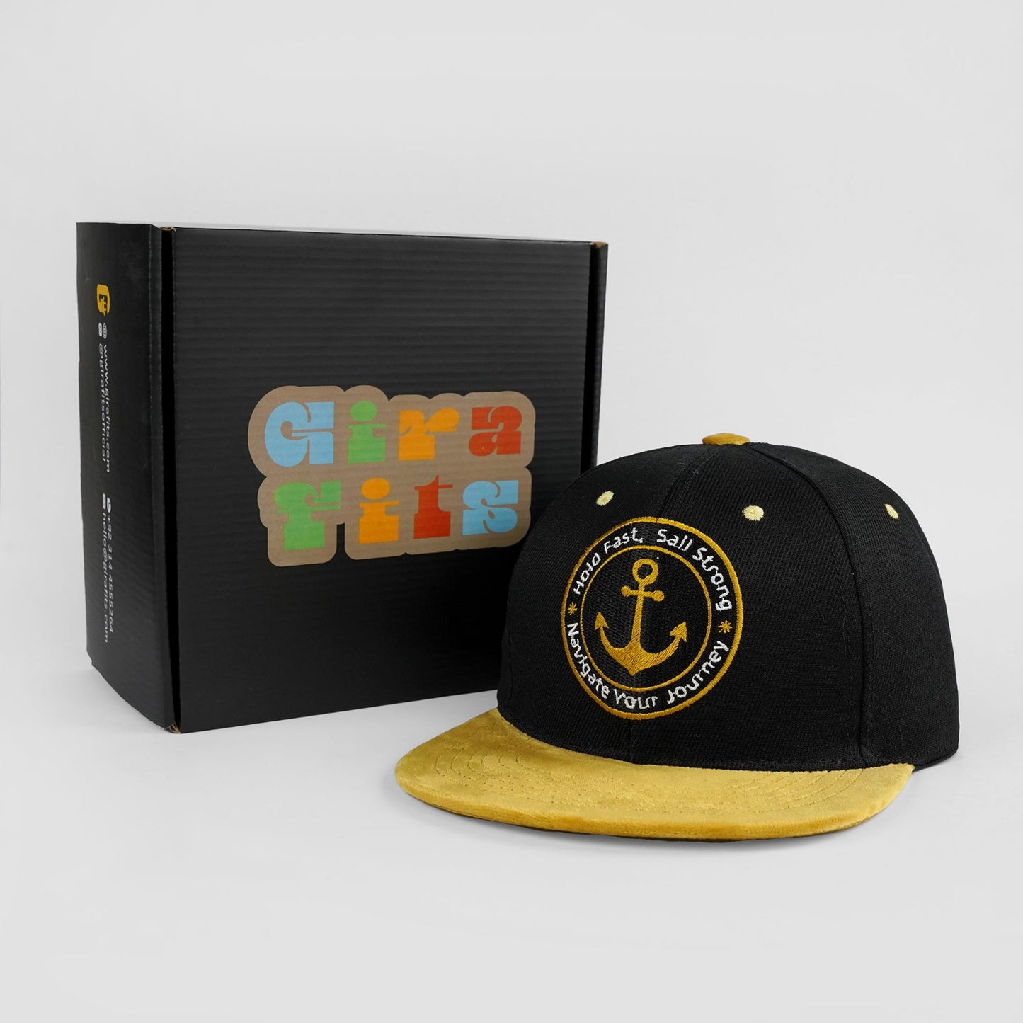 Black and gold snapback with "Sail Strong" premium embroidery
