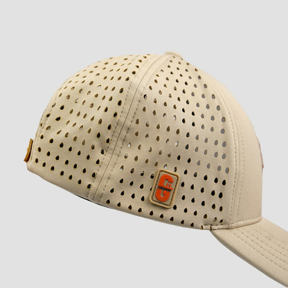 Beige cap with perforated design and a logo on a light gray background
