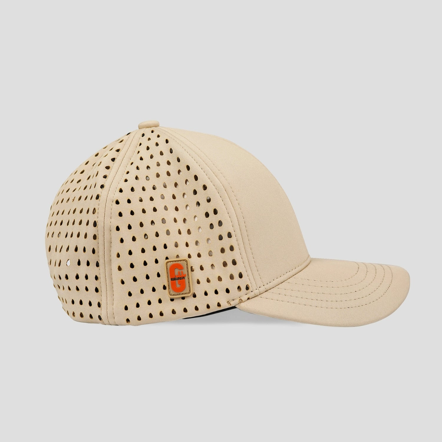 Beige cap with perforated design and visible brand logo on a light gray background