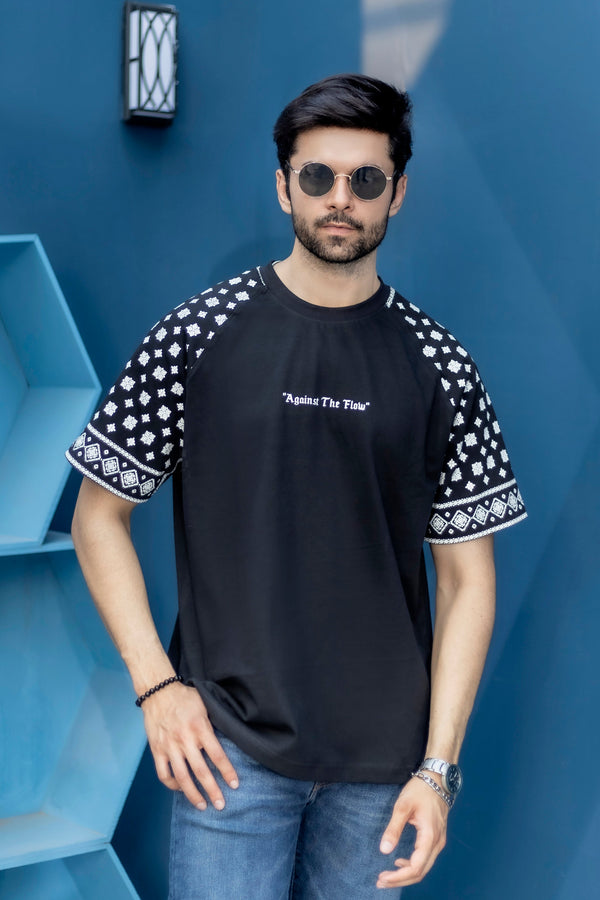 Against The Flow black oversized t-shirt with sleeve print and 220 GSM cotton fabric