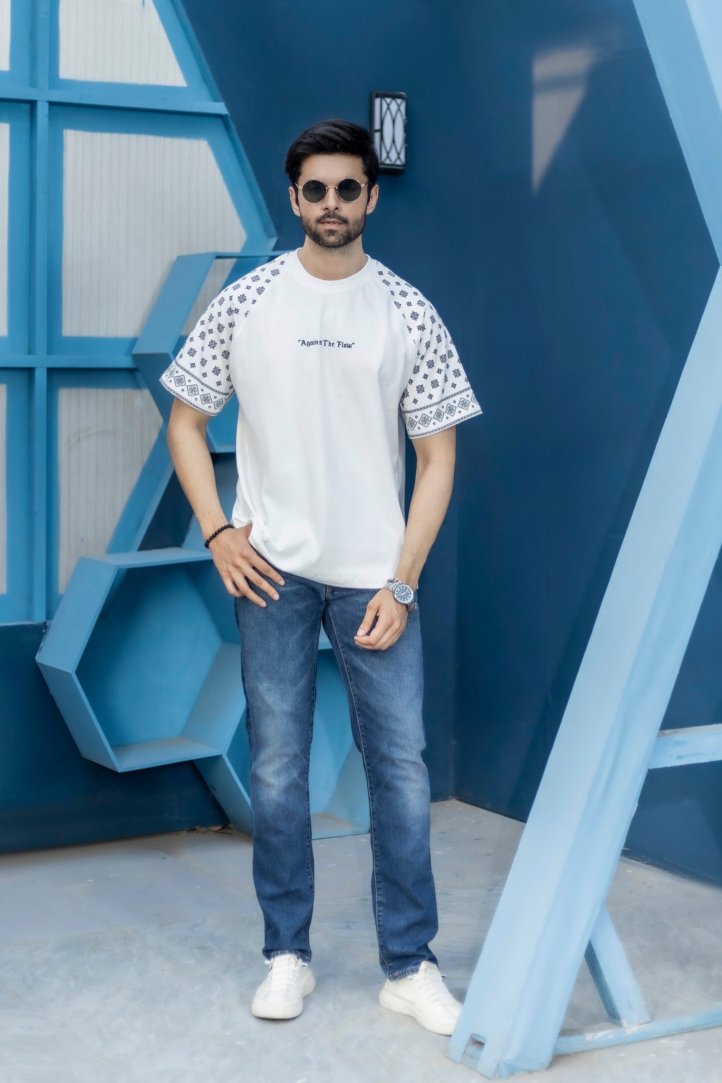 Unisex white oversized tee with pattern sleeves and breathable cotton jersey fabric