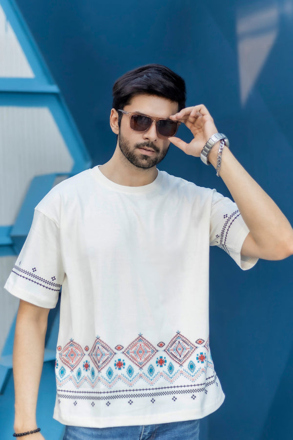 220 GSM white oversized tee with breathable jersey fabric and border artwork