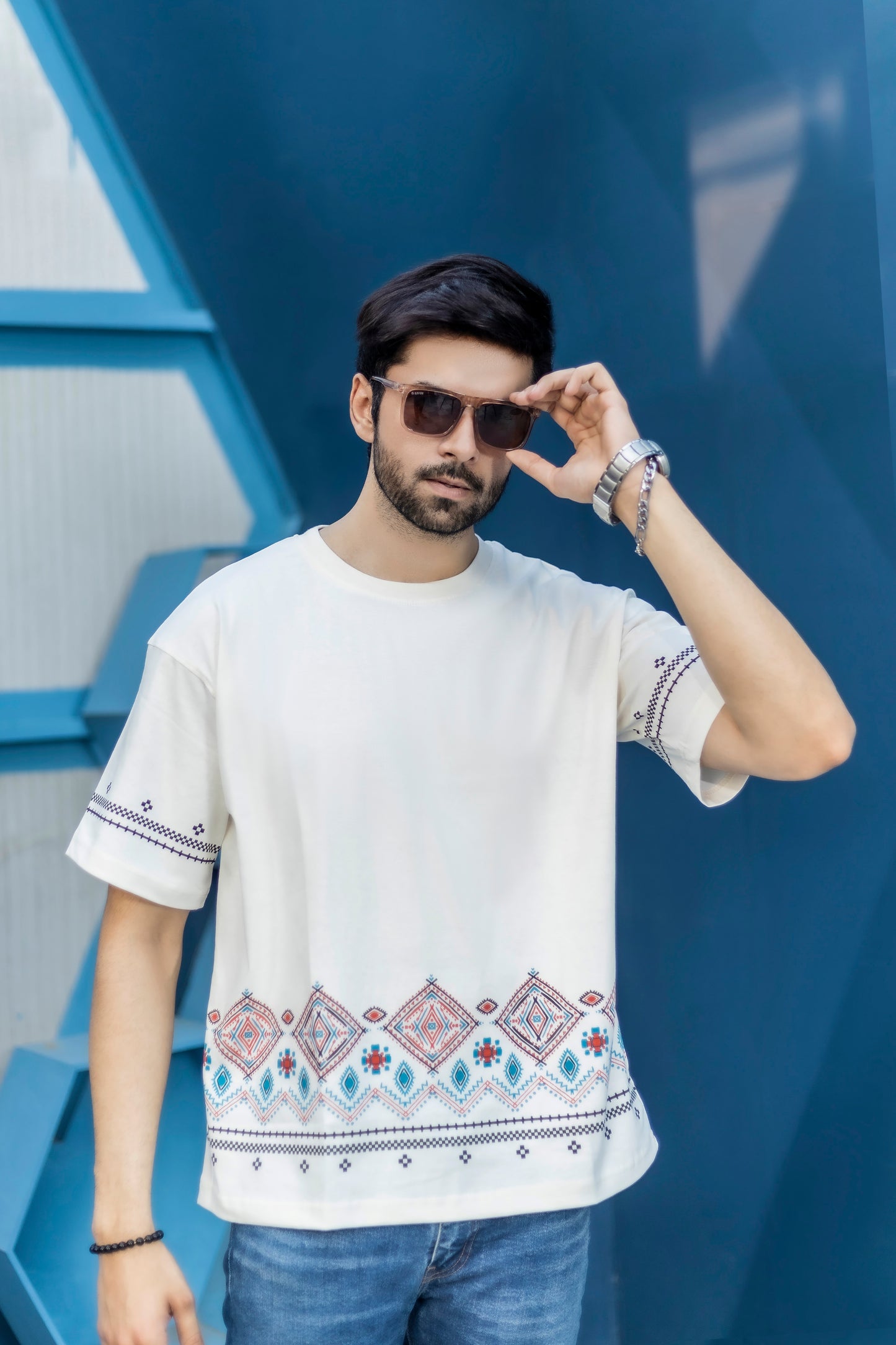 220 GSM white oversized tee with breathable jersey fabric and border artwork