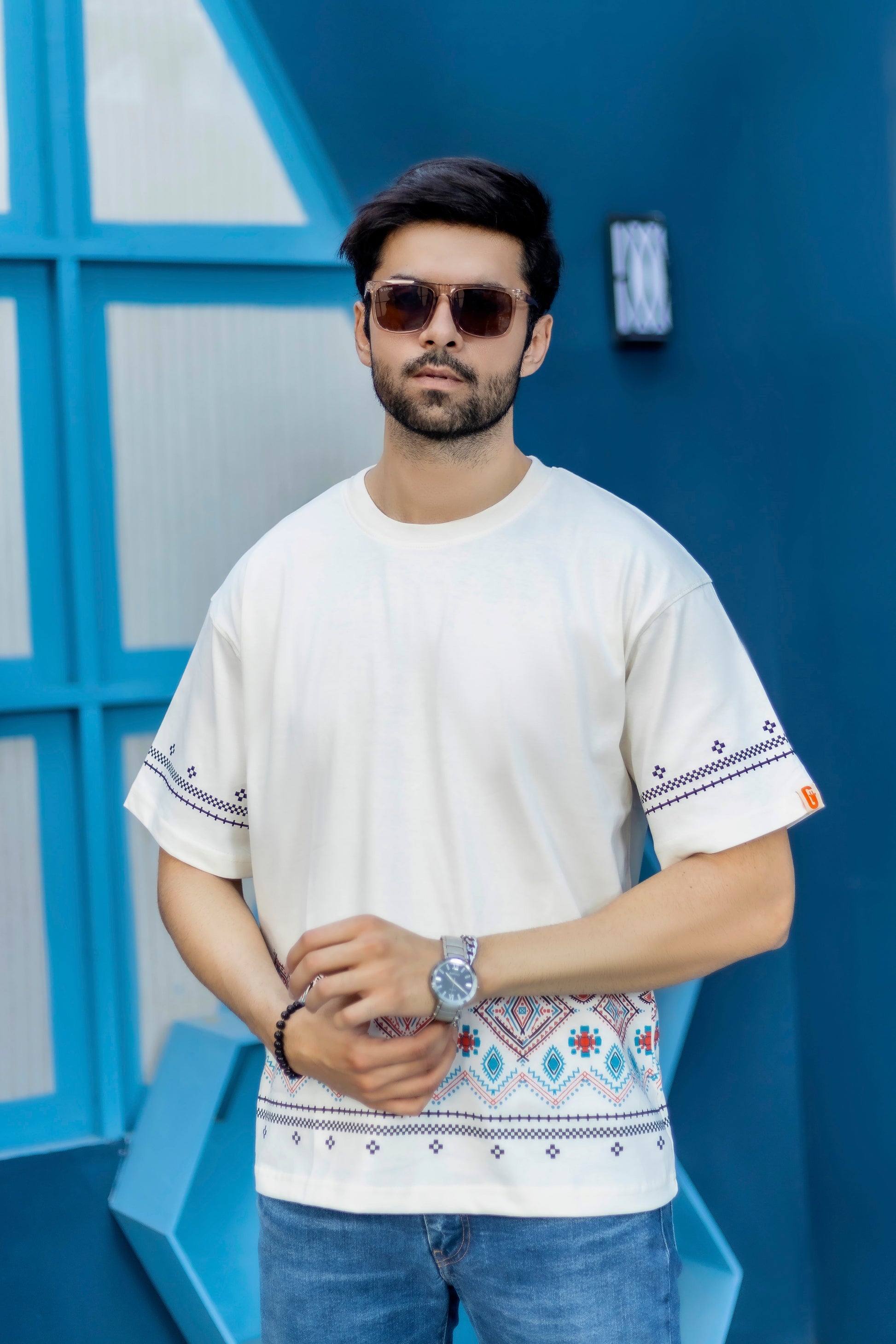 White streetwear oversized t-shirt featuring front border graphics and cotton feel