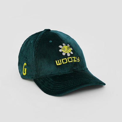 Green cap with yellow text and logo on a light gray background
