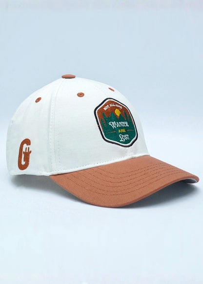 White and brown cap with a logo on a light blue background