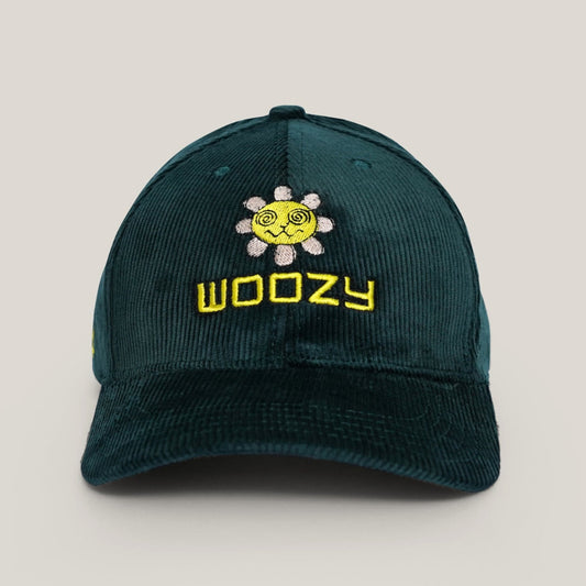 Green cap with yellow 'Woozy' logo on a light gray background