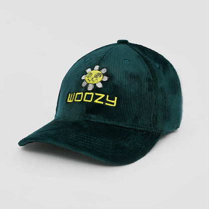 Green cap with 'Woozy' logo and sun design on a light gray background