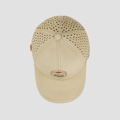 Beige cap with perforated design on a white background