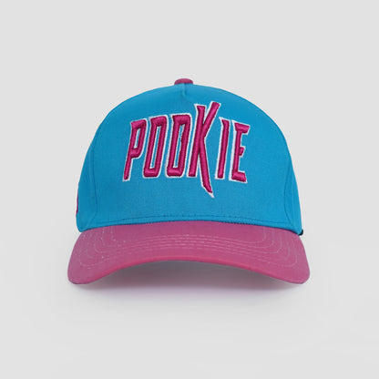 Blue and pink cap with 'POOKIE' text on a white background