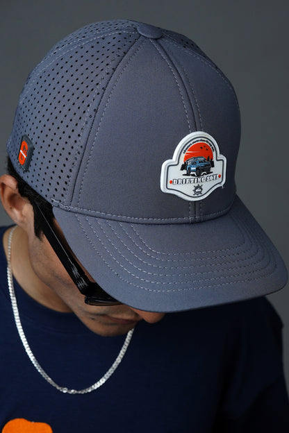Gray softshell baseball cap with “Drifting Soul” design and laser-cut vents