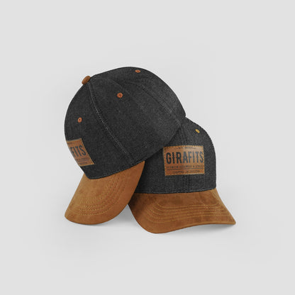 Suede visor cap with denim body and leather logo patch.