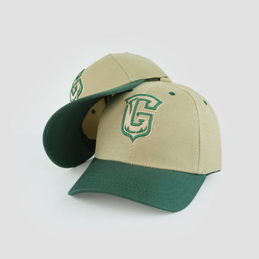 Beige and green baseball cap with 3D embroidered "Girafits Core 02" logo, curved brim, and contrast panels.