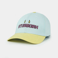 Sky blue and light yellow baseball cap with "Stubborn" embroidery