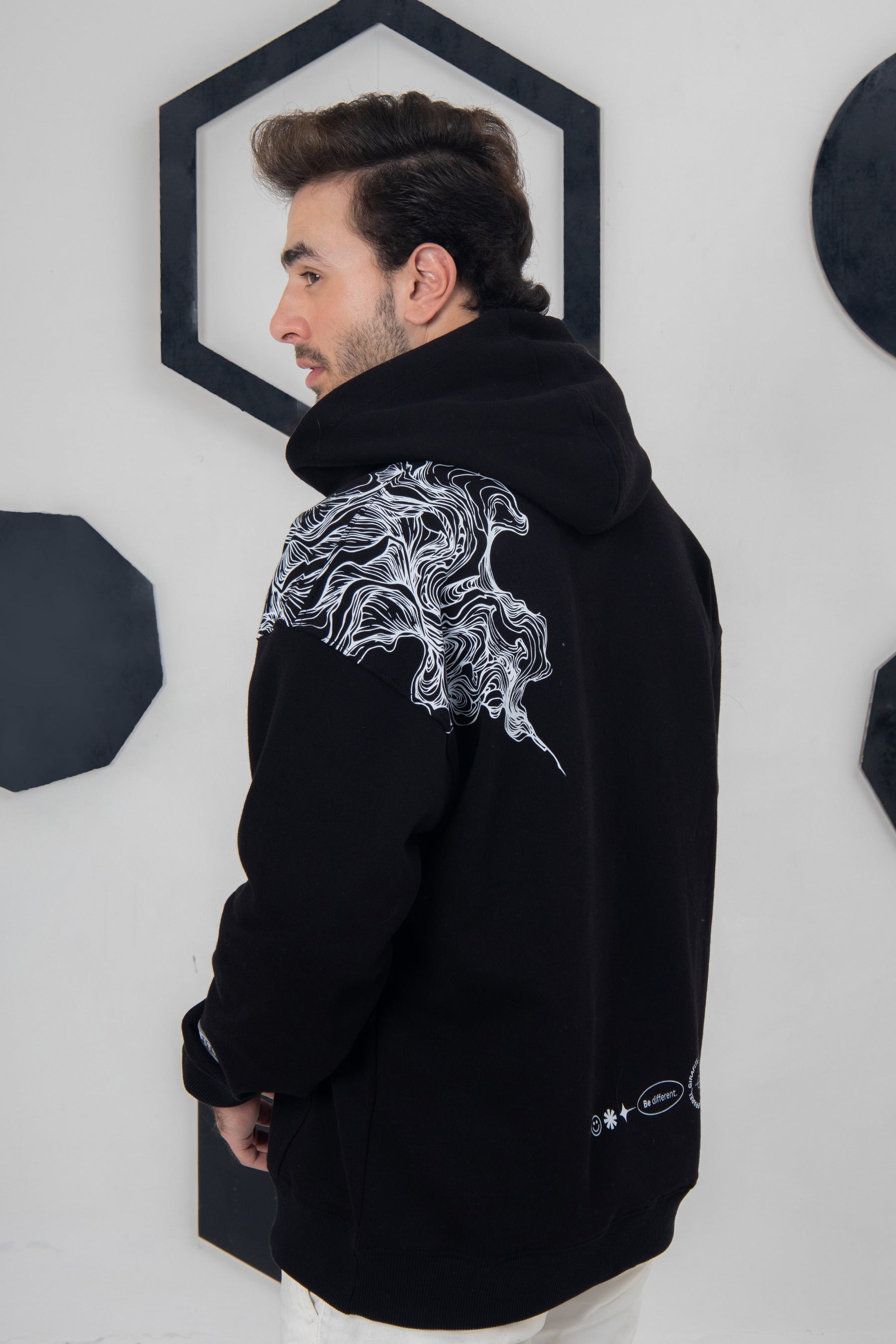 Black fleece hoodie with abstract smoky lines, everyday streetwear style