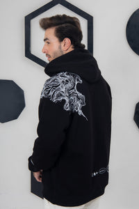 Black fleece hoodie with abstract smoky lines, everyday streetwear style
