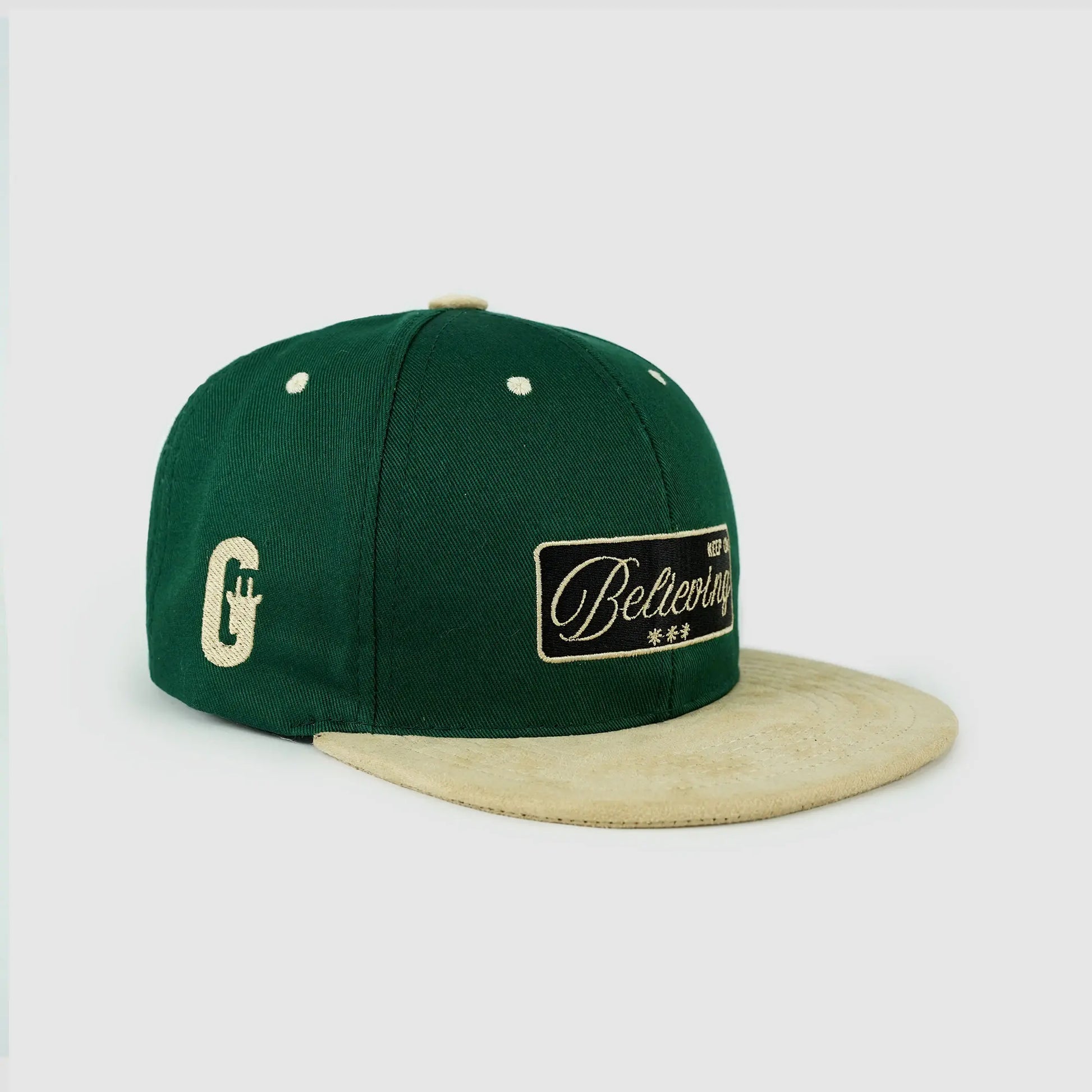 Green and beige snapback with "Keep On Believing" premium embroidery